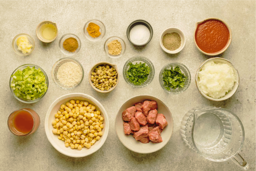 Moroccan harira soup ingredients with lamb, chickpeas, lentils, tomatoes, and spices