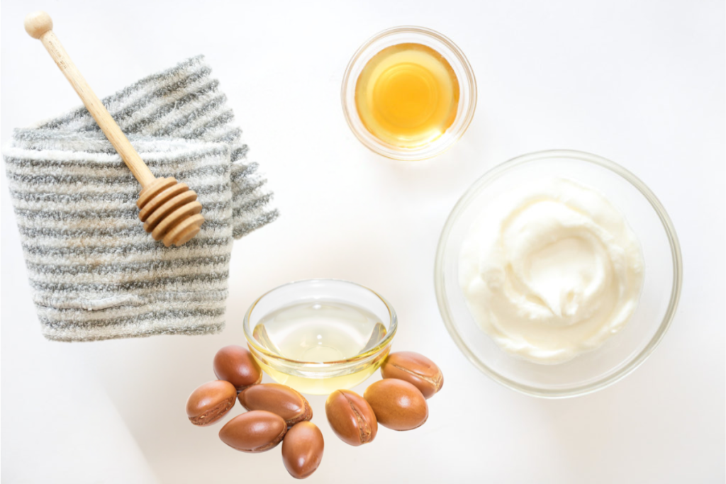 Ingredients for Moroccan argan oil mask including argan oil, honey, and yogurt